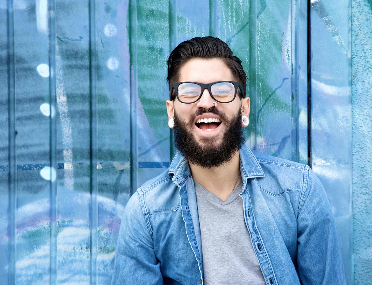 young-man-with-beard-laughing-PF3S7ZY.min_.jpg